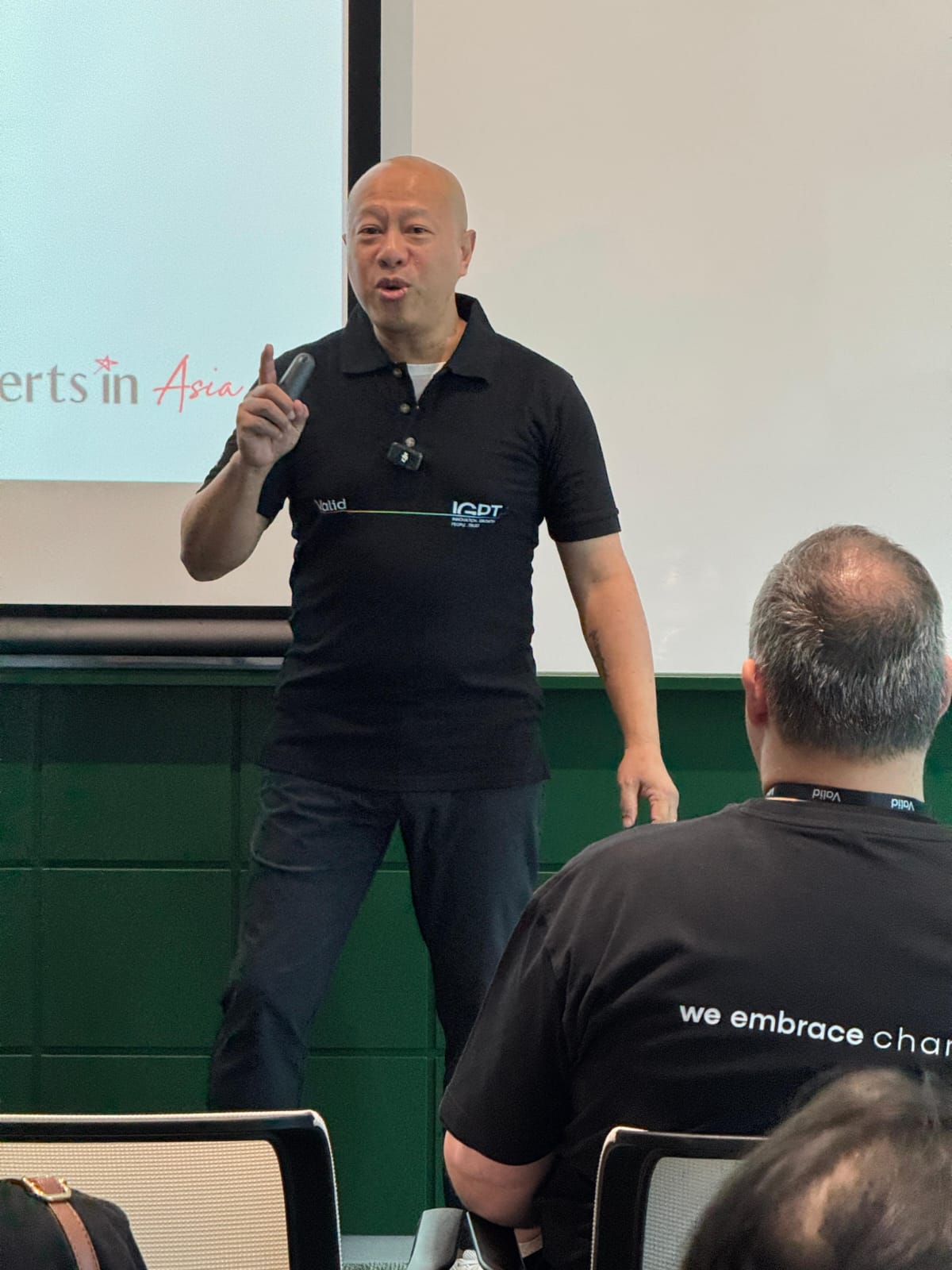 Nadam speaking at a corporate event