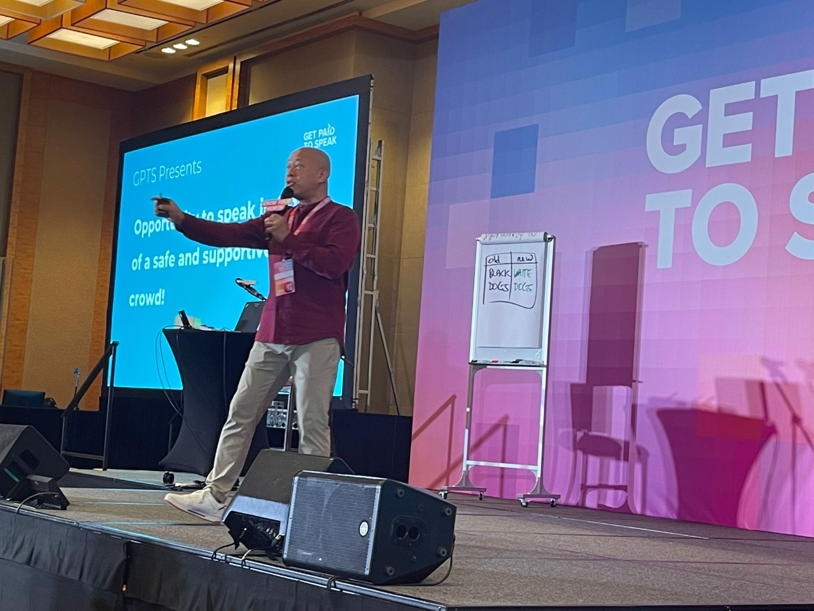 Nadam speaking on stage